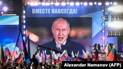 Президент России Владимир Путин выступает на концерте, посвященном захвату части четырех регионов Украины, оккупированных российскими войсками. Москва, 30 сентября 2022 года