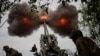 UKRAINE – Ukrainian service members fire a shell from a M777 Howitzer at a front line, as Russia's attack on Ukraine continues, in Kharkiv region, July 21, 2022