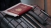  A passport and a suitcase are pictured at Vnukovo International Airport.